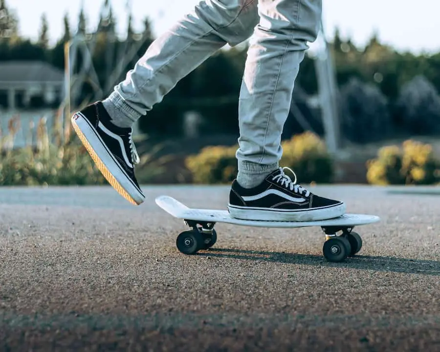 Person wearing Vans, using a skateboard.