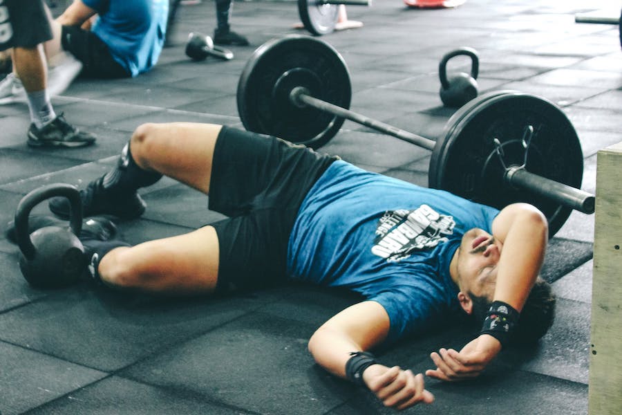 A lifter, who has passed out, laying on the ground.